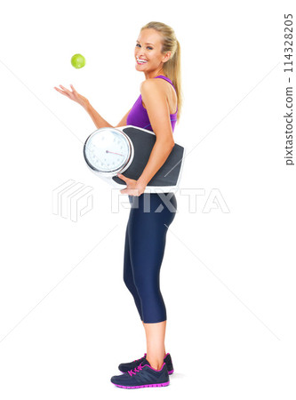 Portrait, scale and apple with woman, fitness and nutrition isolated on a white studio background. Full body, person or model with weight loss or fruit for wellness or healthy with diet plan or smile Portrait, scale and apple with woman, fitness and nutrition isolated on a white studio background. Full body, person or model with weight loss or fruit for wellness or healthy with diet plan or smile 114328205