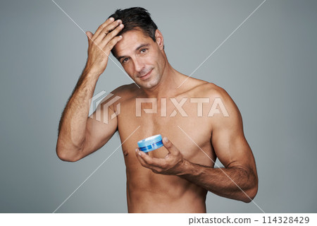 Haircare, hairstyle and man in studio with gel for growth, cosmetics and cosmetology in portrait. Mature person, beauty and bare male with confidence for hair routine or treatment in gray background 114328429