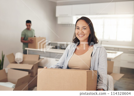 Happy woman, moving and carry box in new house for property, investment and real estate in living room. Female homeowner, smile and joy in apartment for immigration and relocate or home purchase 114328604