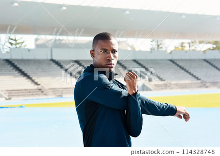 Africa, man and stretching for sports, exercise and warm up in stadium or field for fitness. Male athlete, arms and training on track in outdoor for wellness, muscles and strong in body or mind 114328748