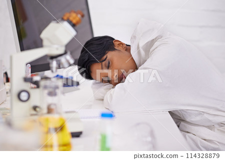 Sleeping, tired and woman scientist in laboratory working overtime on pharmaceutical research. Exhausted, fatigue and female biology researcher with nap for burnout with medical project or study. 114328879