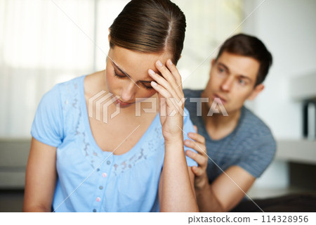 Couple, stress and fight in home with argument or angry with apology and sad in disappointment. Relationship, confrontation and marriage issues in living room on couch with conflict and emotions. Couple, stress and fight in home with argument or angry with apology and sad in disappointment. Relationship, confrontation and marriage issues in living room on couch with conflict and emotions. 114328956