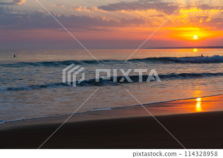 Ocean landscape with cloudy sky at sunset Ocean landscape with cloudy sky at sunset 114328958