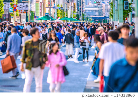 Tokyo cityscape in Japan: Ginza pedestrian precinct crowded with couples during Golden Week...inbound tourism revival = May 5th Tokyo cityscape in Japan: Ginza pedestrian precinct crowded with couples during Golden Week...inbound tourism revival = May 5th 114328960