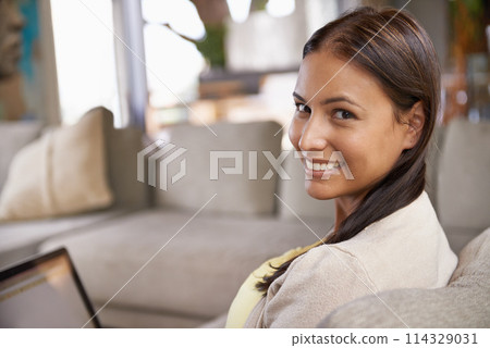 Portrait, woman or laptop on couch on internet, website or social media for browsing in living room. Female person, smile and computer on sofa to relax, search and reading of email at weekend Portrait, woman or laptop on couch on internet, website or social media for browsing in living room. Female person, smile and computer on sofa to relax, search and reading of email at weekend 114329031