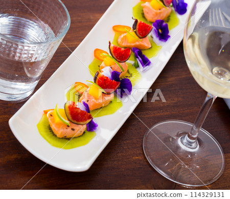 Delicious canapes with marinated salmon Delicious canapes with marinated salmon 114329131