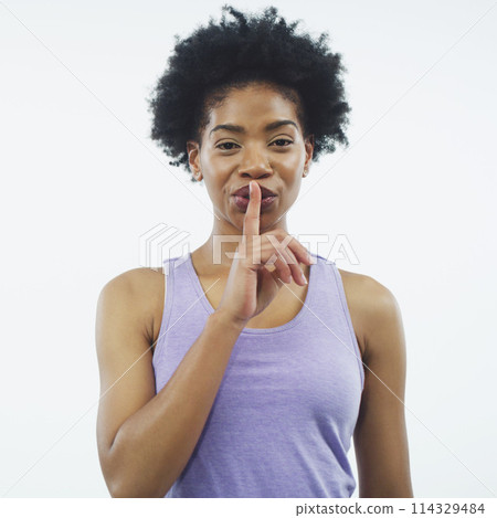 Woman, fitness and finger on lips in studio with secret for deal, info or silence sign by white background. African person, girl and emoji for discount on gym subscription for wellness in portrait 114329484