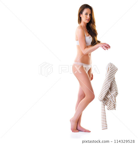 Woman, body and undressing in studio with portrait for sensuality, isolated and white background with mockup. Girl, take off and clothing for hot or heat and confident in lingerie for temptation. Woman, body and undressing in studio with portrait for sensuality, isolated and white background with mockup. Girl, take off and clothing for hot or heat and confident in lingerie for temptation. 114329528