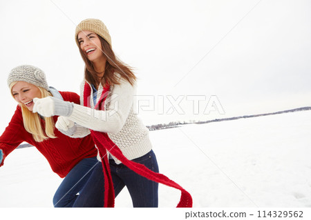 Winter, love and lesbian couple outdoor in snow on romantic vacation, adventure or holiday. Happy, laugh and lgbtq women in relationship for fun and bonding in cold weather on weekend trip in Iceland Winter, love and lesbian couple outdoor in snow on romantic vacation, adventure or holiday. Happy, laugh and lgbtq women in relationship for fun and bonding in cold weather on weekend trip in Iceland 114329562
