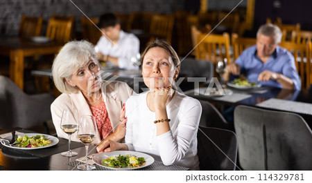 Sad young woman share with friend about difficulties of interpersonal communication in teamwork. 114329781