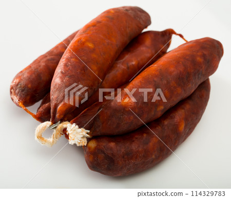 Spanish sausage chorizo on white background, closeup Spanish sausage chorizo on white background, closeup 114329783