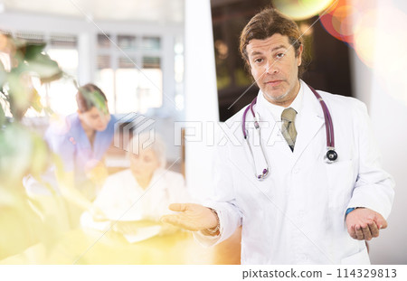 Friendly doctor invites you to visit clinic for diagnosis 114329813