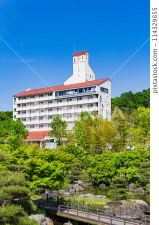 Fresh green Kobe Happiness Village and blue sky 114329855