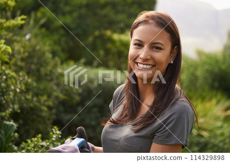 Woman, smile and portrait in a garden for plant pruning, sprout or checking leaf growth outdoor. Backyard, sustainability or face of happy female person gardening in spring with fresh air or sunshine Woman, smile and portrait in a garden for plant pruning, sprout or checking leaf growth outdoor. Backyard, sustainability or face of happy female person gardening in spring with fresh air or sunshine 114329898