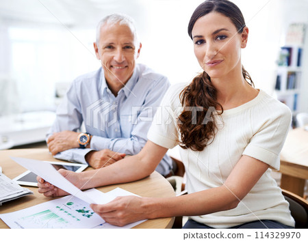 Portrait, businessman and woman with paperwork, tablet and sales review for growth, development and stats. Planning, strategy and business people at desk for data analysis, feedback or profit report 114329970