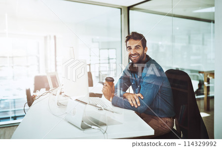 Man, technology and office portrait with coffee, lens flare and startup business. Morning light, entrepreneur face and creative job by desk with computer, reading email and online work for web design 114329992