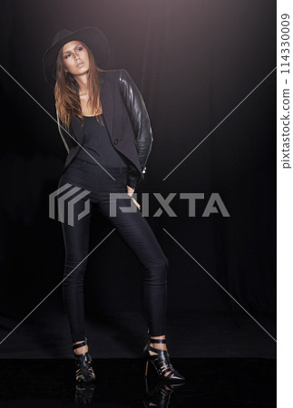 Classic fashion, thinking and young woman in studio on black background with flare for classy chic. Leather, model and vision with confident person in dark or trendy clothes outfit for style 114330009