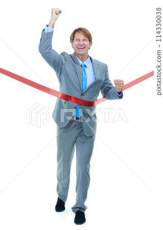 Happy, businessman and running with finish line for success, completion or victory on a white studio background. Excited man or employee with smile and fist pump in celebration for winning on mockup Happy, businessman and running with finish line for success, completion or victory on a white studio background. Excited man or employee with smile and fist pump in celebration for winning on mockup 114330038