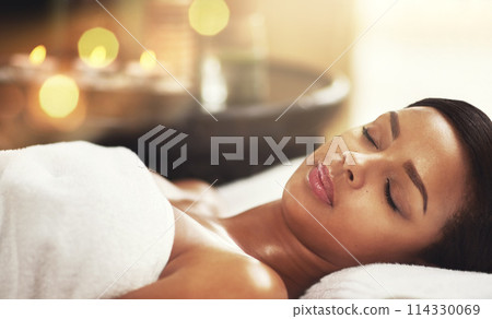 Woman, spa and relax on massage table or sleep, calm and peaceful on holiday vacation or wellness or hospitality resort. Skincare and therapy for client or body care, eyes closed and town for comfort 114330069