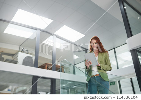 Low angle, business woman and tablet in office for career, web project or occupation review online for email feedback. Young female person or editor and tech for digital report research on mockup 114330104