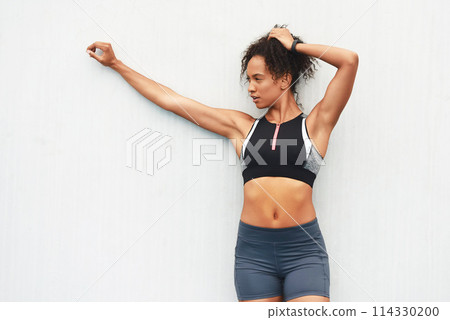 Athlete, girl and outdoor with sportswear, wall and break from workout, practice and training of body. Exercise, healthy and strong with muscle, wellness and energy for sports, active and weekend 114330200
