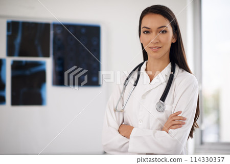 Portrait, confident doctor and woman in hospital for healthcare, wellness or xray in Brazil. Face, medical professional and employee with arms crossed, worker or radiology expert with pride in clinic Portrait, confident doctor and woman in hospital for healthcare, wellness or xray in Brazil. Face, medical professional and employee with arms crossed, worker or radiology expert with pride in clinic 114330357
