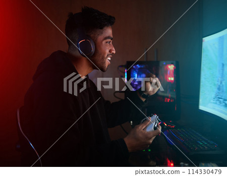 Pro gamer, man and cheers for winning with fist, goals and success in global rpg contest on web. Person, winner and excited with celebration, challenge or competition with computer in home at night Pro gamer, man and cheers for winning with fist, goals and success in global rpg contest on web. Person, winner and excited with celebration, challenge or competition with computer in home at night 114330479