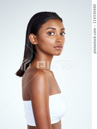 Portrait, skincare and Indian woman in makeup in studio for wellness isolated on a white background mockup space. Face, cosmetics and beauty of serious model for dermatology, shine or body for health 114330480