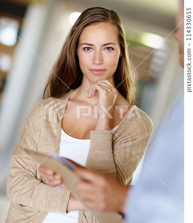 Woman, listening and confidence in building with person, files and folder for communication, ideas and collaboration. Female worker, career and portrait in workplace with colleague for work. 114330655