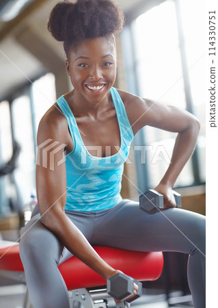 Black woman, gym and weights for fitness in portrait for wellness with health for goal with smile for strong athlete. Training, sports and cardio with self love for bodycare with run for victory Black woman, gym and weights for fitness in portrait for wellness with health for goal with smile for strong athlete. Training, sports and cardio with self love for bodycare with run for victory 114330751