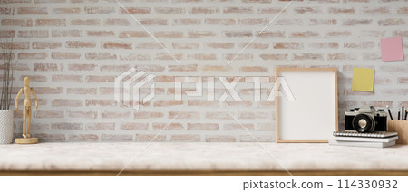 A space for display products on a white marble tabletop features decor against the brick wall. A space for display products on a white marble tabletop features decor against the brick wall. 114330932
