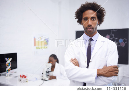 Scientist, portrait and arms crossed with confidence in laboratory for chemical research, medical study and serious. Science, african collaboration and face with pride for pharmaceutical experiment Scientist, portrait and arms crossed with confidence in laboratory for chemical research, medical study and serious. Science, african collaboration and face with pride for pharmaceutical experiment 114331326