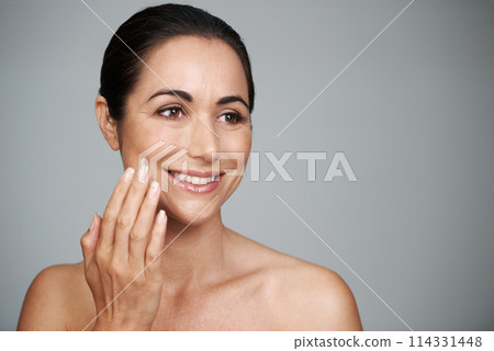 Face cream, beauty and mature woman in studio for skincare, natural and face treatment. Smile, cosmetic and female person with spf, lotion or sunscreen for dermatology routine by gray background. Face cream, beauty and mature woman in studio for skincare, natural and face treatment. Smile, cosmetic and female person with spf, lotion or sunscreen for dermatology routine by gray background. 114331448