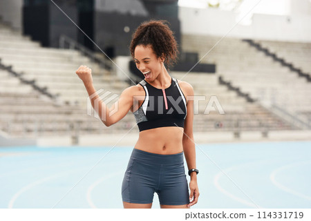 Woman, athlete and flexing on track field for strength, training and fitness goals in summer. Winner, happiness and workout in stadium for wellness, cardio and exercise for outdoor challenge 114331719