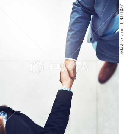 Handshake, welcome and business men in office with b2b deal, collaboration or agreement. Professional, meeting and aerial view of male lawyers shaking hands for greeting or partnership in workplace. 114331887