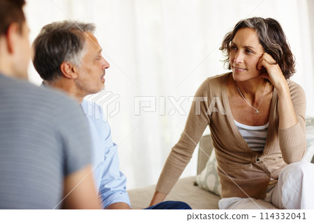 Mature couple, sofa and smiling in house living room with discussion, communication and decision. Man, woman and consultant for retirement fund, advice and counselling on investment or annuity plan Mature couple, sofa and smiling in house living room with discussion, communication and decision. Man, woman and consultant for retirement fund, advice and counselling on investment or annuity plan 114332041