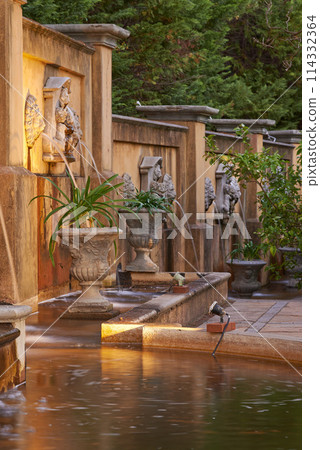 Pond, architecture and vintage in holiday resort for heritage, ancient and historic garden or structure in India. Travel, culture and vacation accommodation for tourist, adventure and leisure Pond, architecture and vintage in holiday resort for heritage, ancient and historic garden or structure in India. Travel, culture and vacation accommodation for tourist, adventure and leisure 114332364