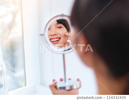 Woman, beauty and skincare routine in mirror for wellness, healthy skin and face products. Female person, smile and cosmetics for clear, pure and hydrated in home for dermatology, clean and moisture 114332435