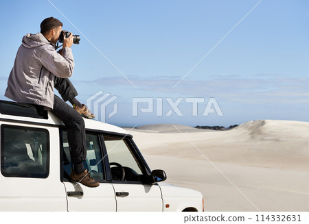 Road Trip, dunes and man in nature for photography, desert landscape and travel for holiday. Pictures, 4x4 and nomad male person in Sahara terrain, outdoor and transport in dry climate and scenery 114332631