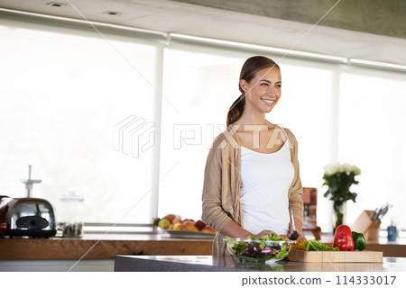 Woman, kitchen and vegetables for nutrition or healthy meal, diet and food preparation for cooking. Female person, home and fresh produce for salad or vegan dinner, organic ingredients and vitamins 114333017