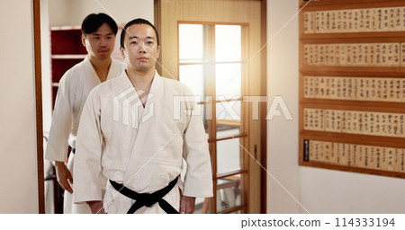 Black belt students, training and respect in dojo for aikido practice, discipline or self defense. Martial arts combat, Japanese people learning and workout for fighting class and group education Black belt students, training and respect in dojo for aikido practice, discipline or self defense. Martial arts combat, Japanese people learning and workout for fighting class and group education 114333194