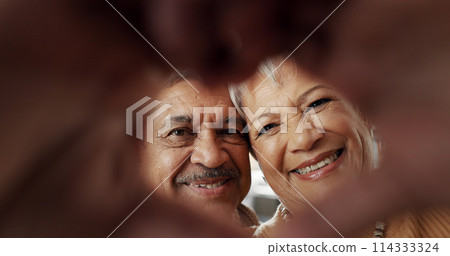 Happy, selfie and senior couple in a living room with heart, hands or frame zoom in their home together. Smile, portrait and elderly people bond in retirement with profile picture, memory or love Happy, selfie and senior couple in a living room with heart, hands or frame zoom in their home together. Smile, portrait and elderly people bond in retirement with profile picture, memory or love 114333324