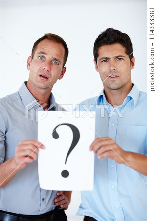Confused, businessmen and question mark on paper for unsure, company and colleagues isolated on white background. Male people, professional and teamwork for workplace regulations, staff and studio. 114333381