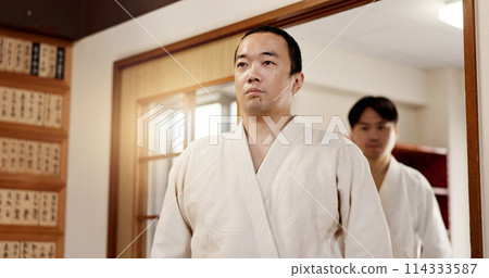 Aikido student, ready or men in dojo to start practice, discipline or self defense education in Japan. Master, people learning sports or athletes walking in fighting class, lesson or training 114333587