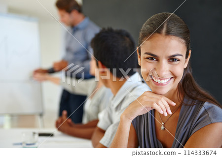 Woman, smile and portrait in office for career and professional for company or workplace. Young person with coworkers or colleagues and happy for board meeting and project management for employment 114333674