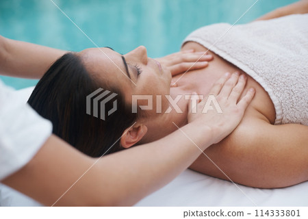 Hands, woman and masseuse at spa for massage, health and wellness for zen, therapy or peace. Female person, lady or relax for luxury, body or wellbeing on table, natural or calm near pool 114333801