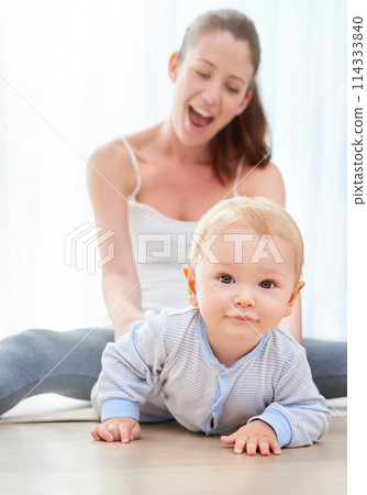Baby, crawl and portrait with mom for child development in house with surprise for learning or discovery in youth. Milestone, early childhood and bonding with cute, single mother and parenting. 114333840
