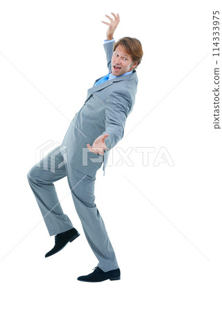 Business, fall and man with mistake, accident or employee isolated on white studio background. Person, model or entrepreneur with movement or fail with reaction or corporate professional with startup 114333975