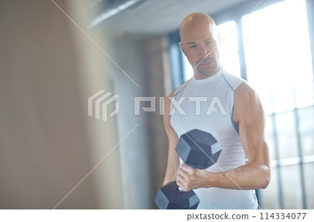 Man, bodybuilder and weight lifting portrait in gym for fitness with dumbbell, workout challenge and strong muscle. Athlete, strength training or bodybuilding exercise for power competition on mockup Man, bodybuilder and weight lifting portrait in gym for fitness with dumbbell, workout challenge and strong muscle. Athlete, strength training or bodybuilding exercise for power competition on mockup 114334077