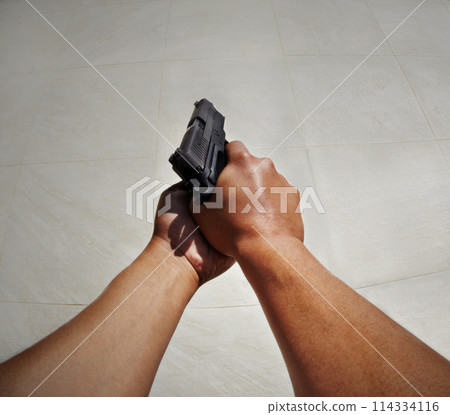 Hands, pov and man with gun against white background for target, practice or training on mockup. Space, weapon and security guard with firearm for shooting, legal or protection from crime or danger Hands, pov and man with gun against white background for target, practice or training on mockup. Space, weapon and security guard with firearm for shooting, legal or protection from crime or danger 114334116